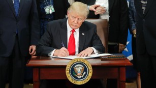 170125134602-01-trump-executive-order-immigration-0125-medium-plus-169